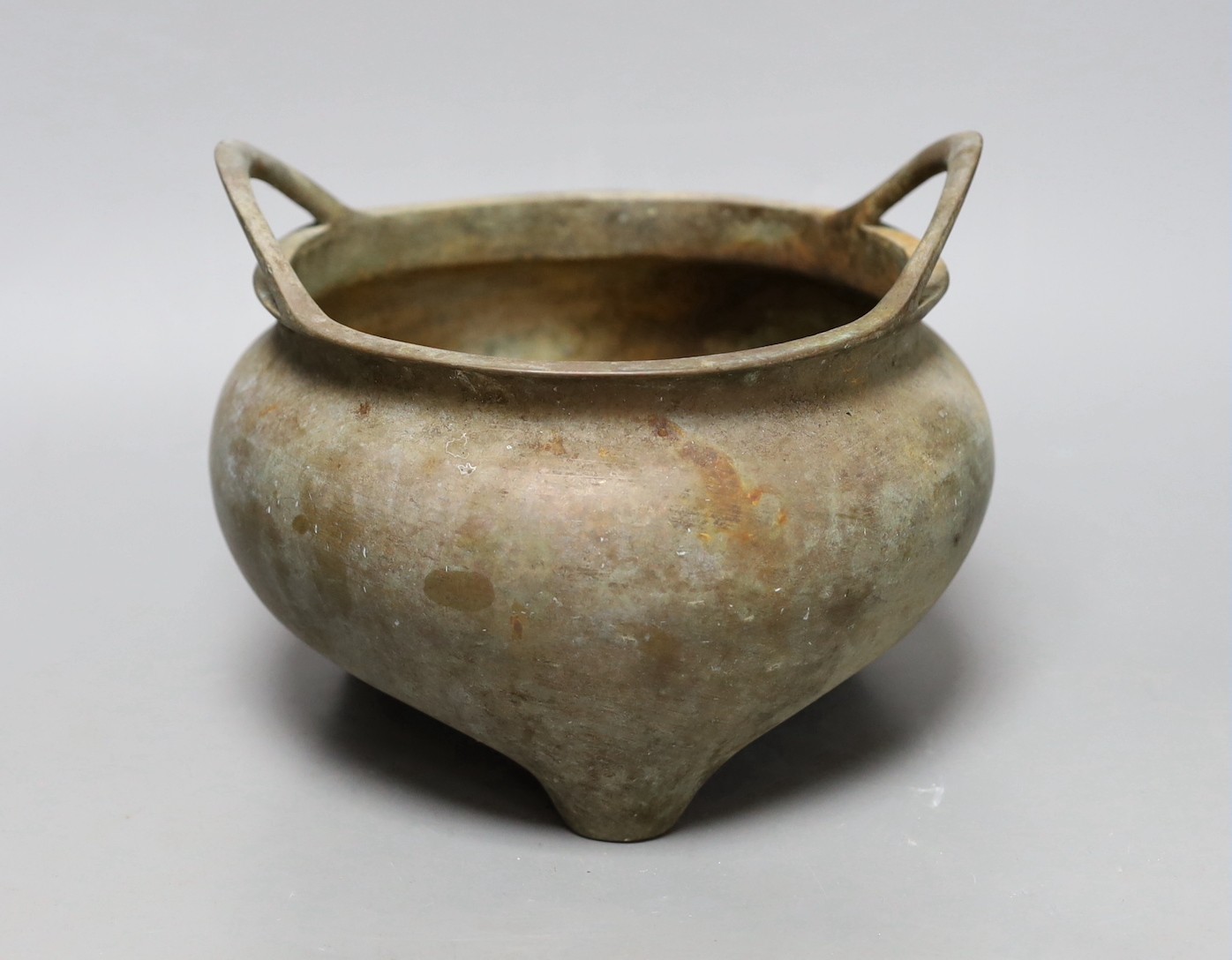 A Chinese two handled bronze censer, 18cm handle to handle